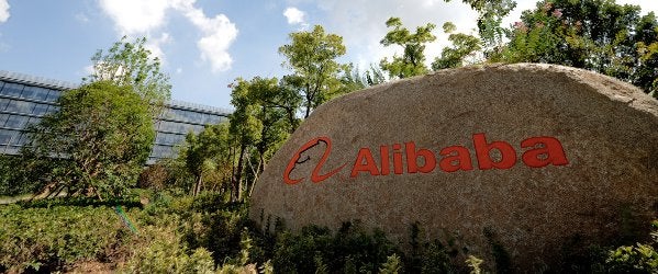 Alibaba clinches 10% stake in postal service