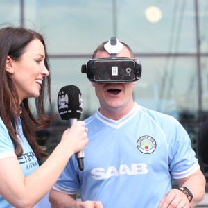 Man City matchday host testing out VR headset.
