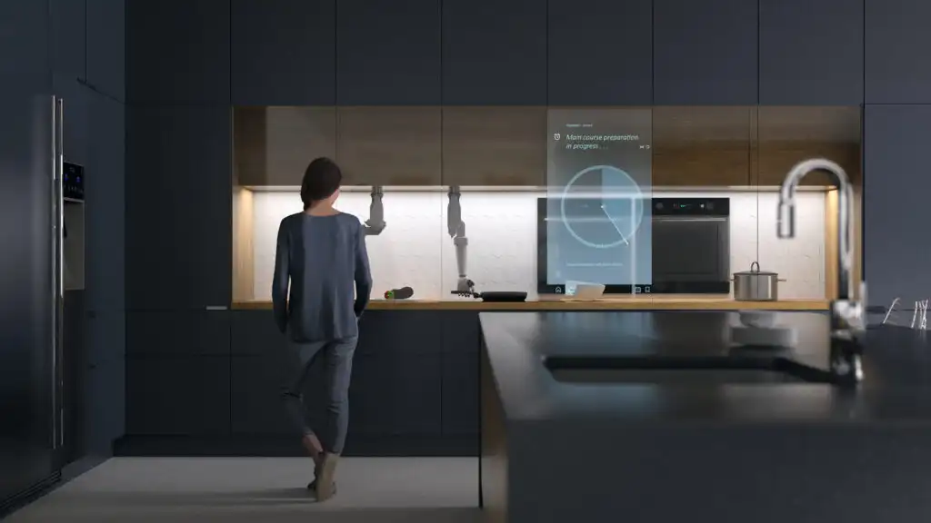 Woman in smart kitchen of the future utilising ambient computing.