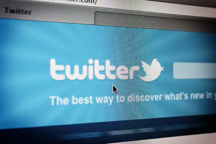 A photo of the social network Twitter appearing on screen.
