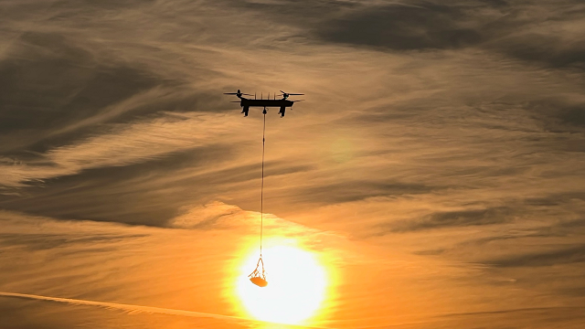 Drones flying off into sunset.