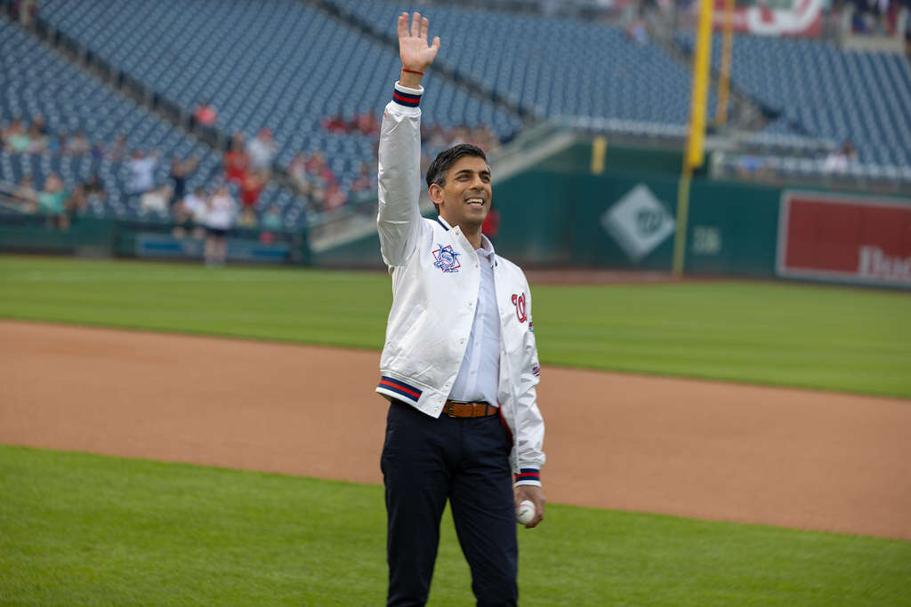 UK Prime Minister Rishi Sunak attending a baseball match, a trip which saw him announce that the UK would host a summit for the global AI community.