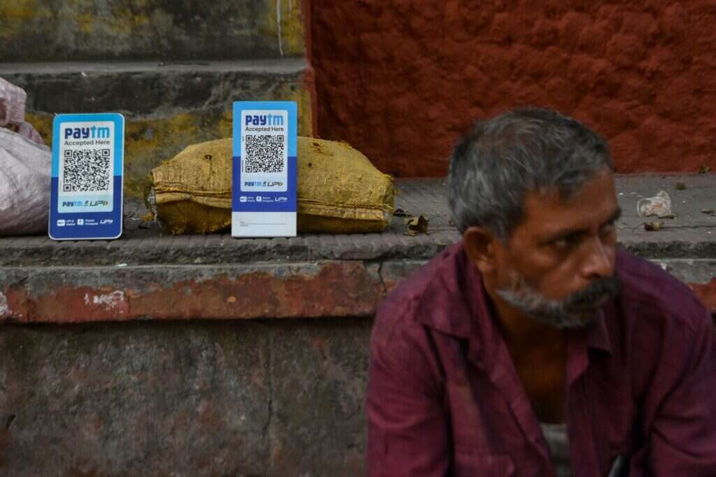 A street vendor sells products using UPI QR Codes