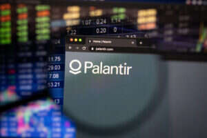 An image of a database and a web browser window saying "Palantir" and showing its logo. It is under a magnifying glass.