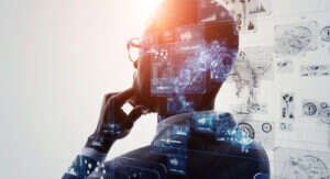 A concept image of AI. A man is thinking, with his back to the viewer, with streams of information coming from his head.
