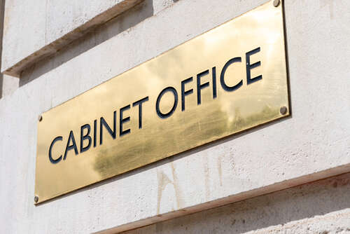 A gold sign that says Cabinet Office. 