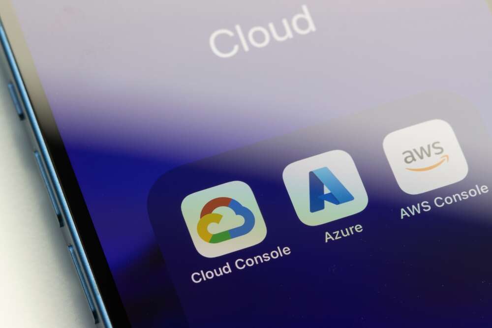 A phone screen displaying the icons of the three leading cloud providers in the UK market: Google Cloud, Microsoft Azure, and Amazon Web Services.