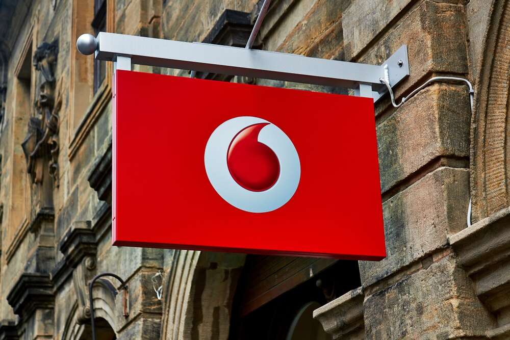 A shop sign for a Vodafone mobile store, used to illustrate a story about the telco's new partnership with Microsoft.