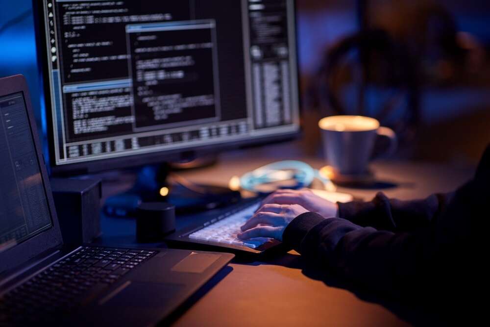 An image of a person observing lines of computer code on a screen, used to illustrate a story about the publication of a new set of cybersecurity guidelines for businesses in the UK.