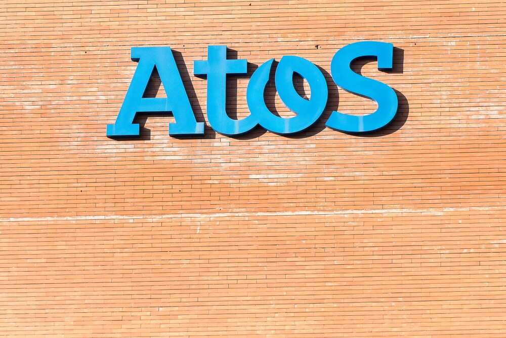 A photo of the Atos logo on a brick wall, used to illustrate a story about an Atos debt refinancing attempt.