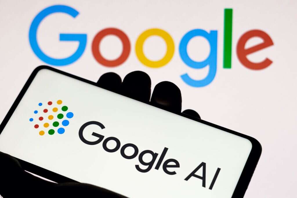 Google AI model which was prompted the fine is shown on a phone and Google logo is in the background