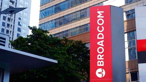 A sign showing the Broadcom logo outside an office building in Jakarta, Indonesia, used to illustrate an article about its takeover of VMware.
