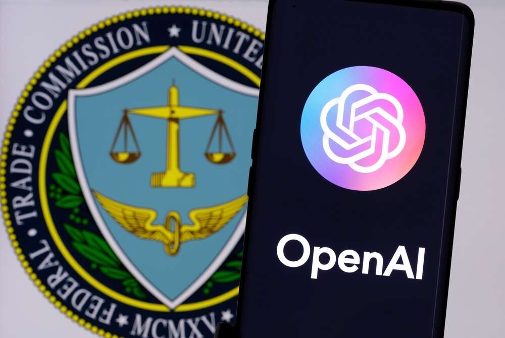 The logo of OpenAI on a smartphone, backgrounded by the logo of the US Federal Trade Commission (FTC).